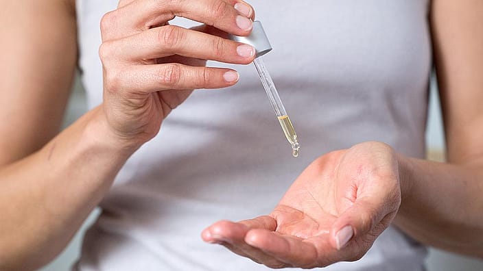 hand with pipette